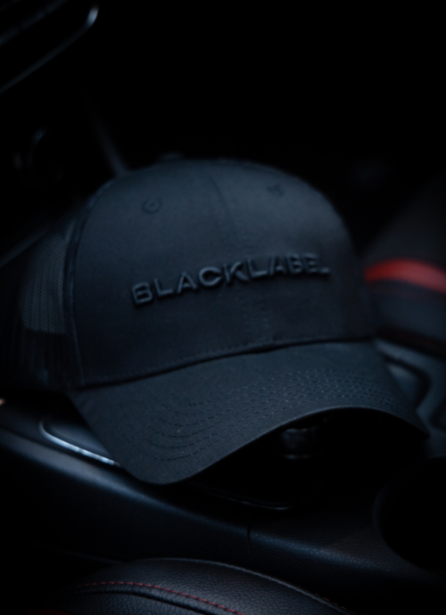 Black Label Embossed Black Trucker Cap
